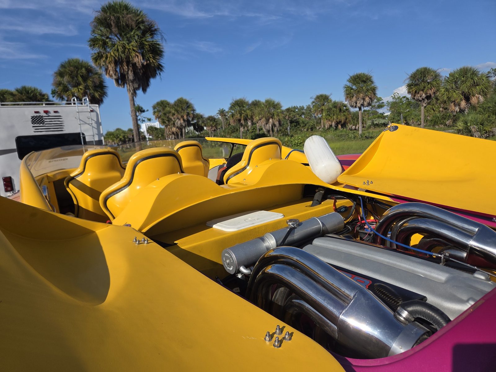 Open cockpit and engine bay — headers, plumbing and rigging on full display