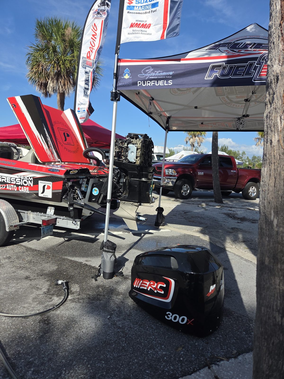 Fuel1 / PurFuels tent with a Mercury 300X cowling on the deck