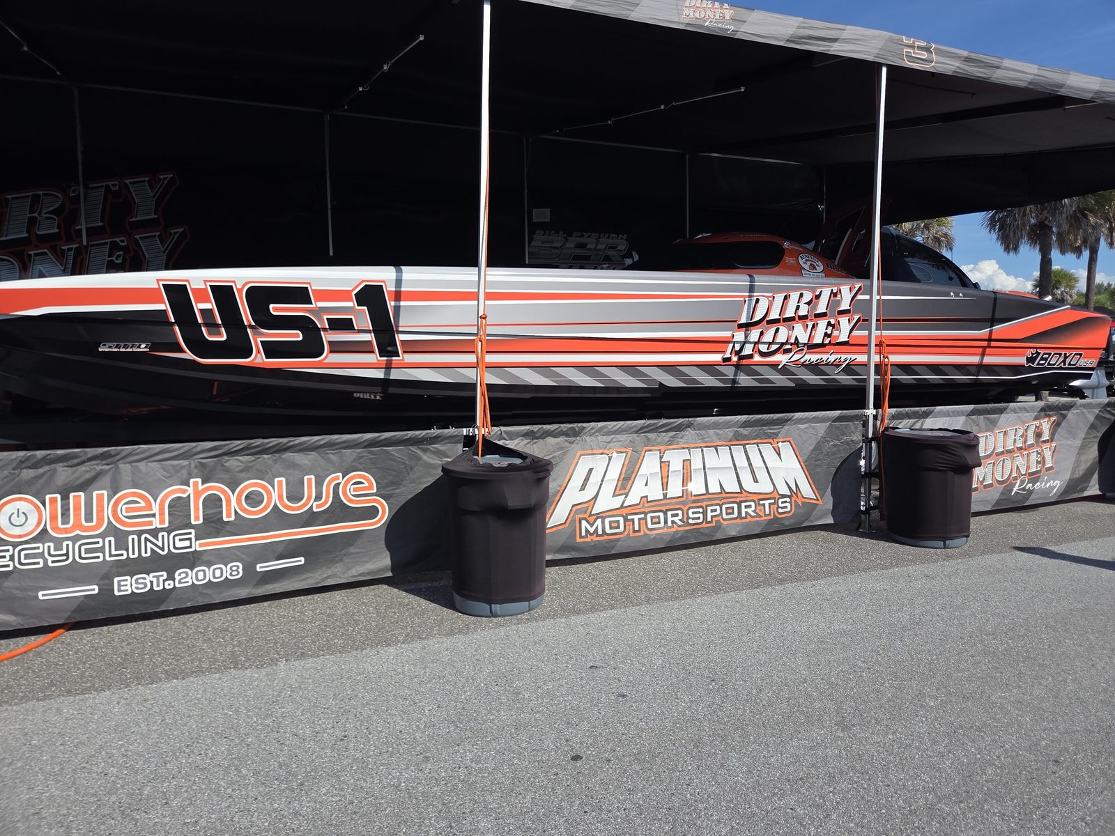 Dirty Money Racing US-1 in the Super Cat pits, Platinum Motorsports and Powerhouse Recycling on the banner