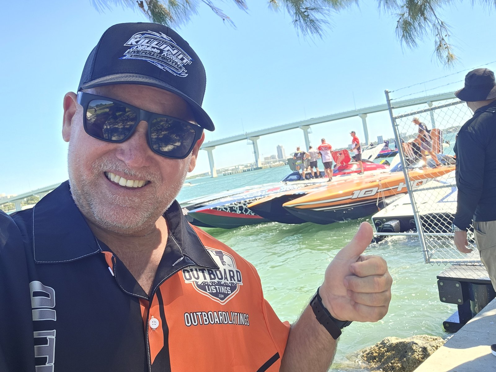 OutboardLISTINGS.com selfie with race boats behind