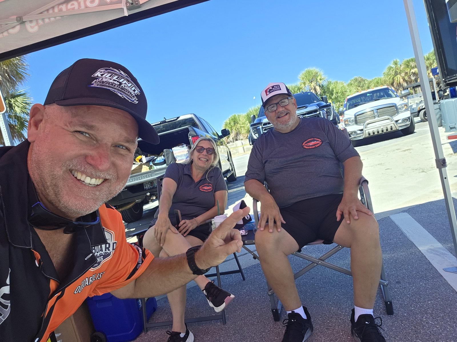 OutboardLISTINGS.com selfie with friends under a canopy at Clearwater