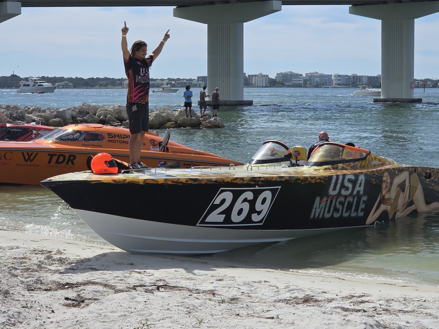 Race boat 269 USA Muscle with a crew member celebrating, Victory Racing USA second in Bracket 200
