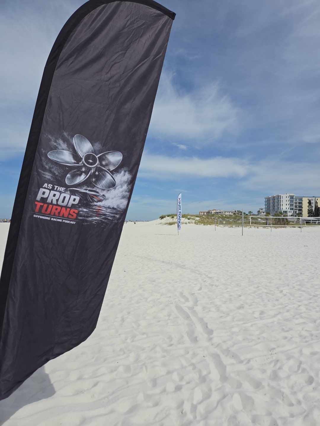 As The Prop Turns beach flag on the sand at Clearwater