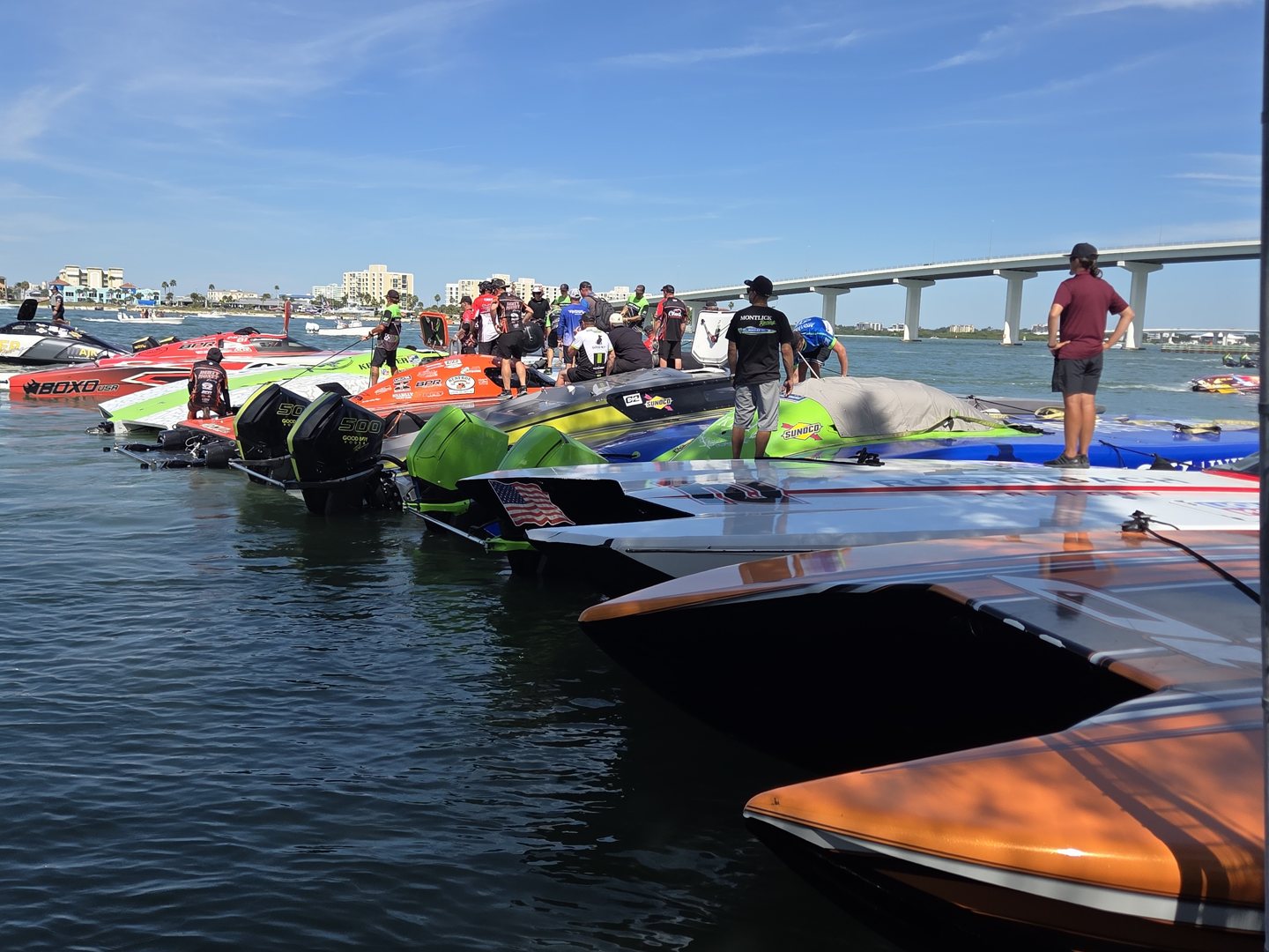 Offshore race boats lined up along the seawall in the Clearwater hot pits