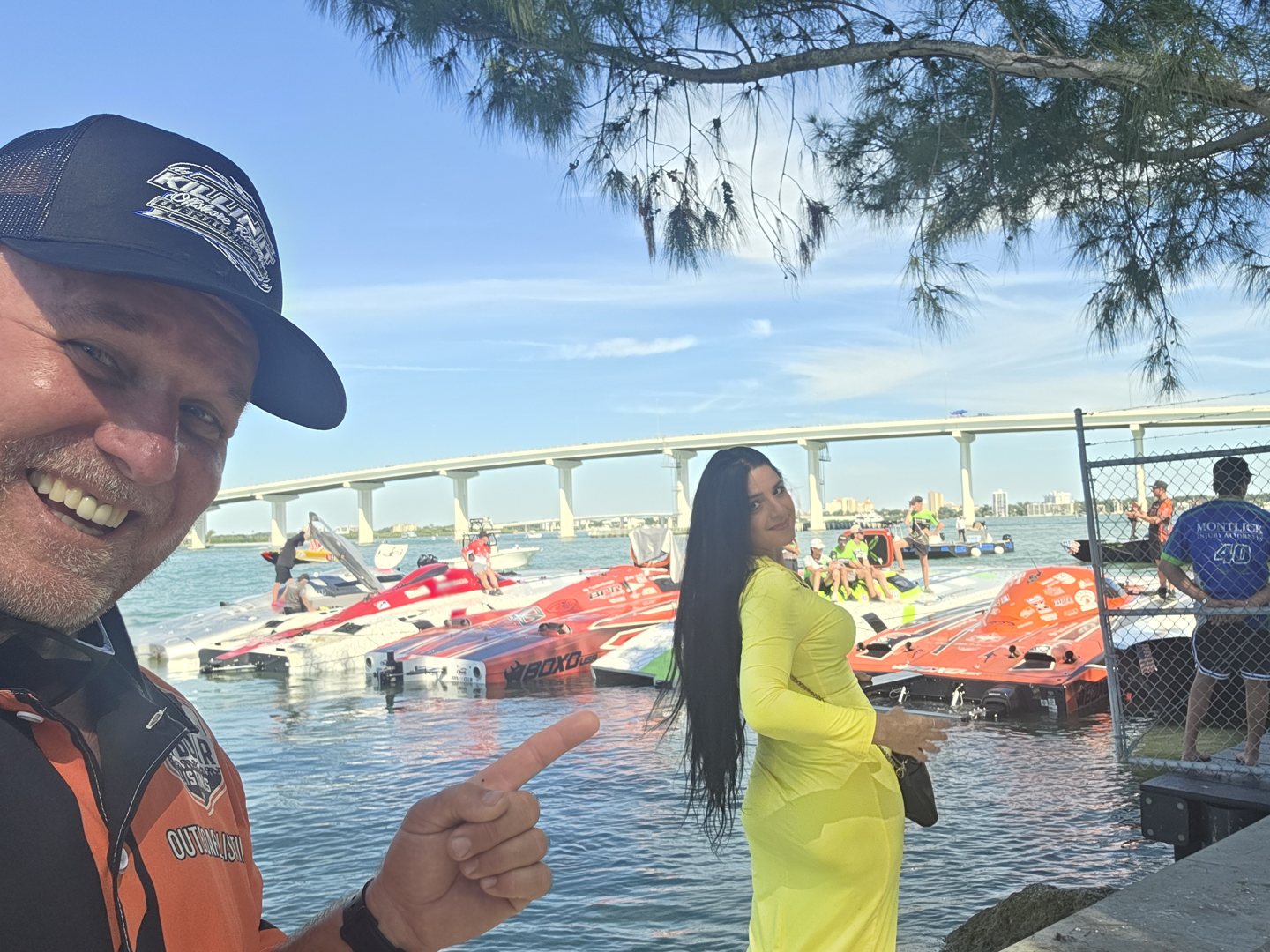 Selfie at the Clearwater hot pits with race boats and the bridge behind