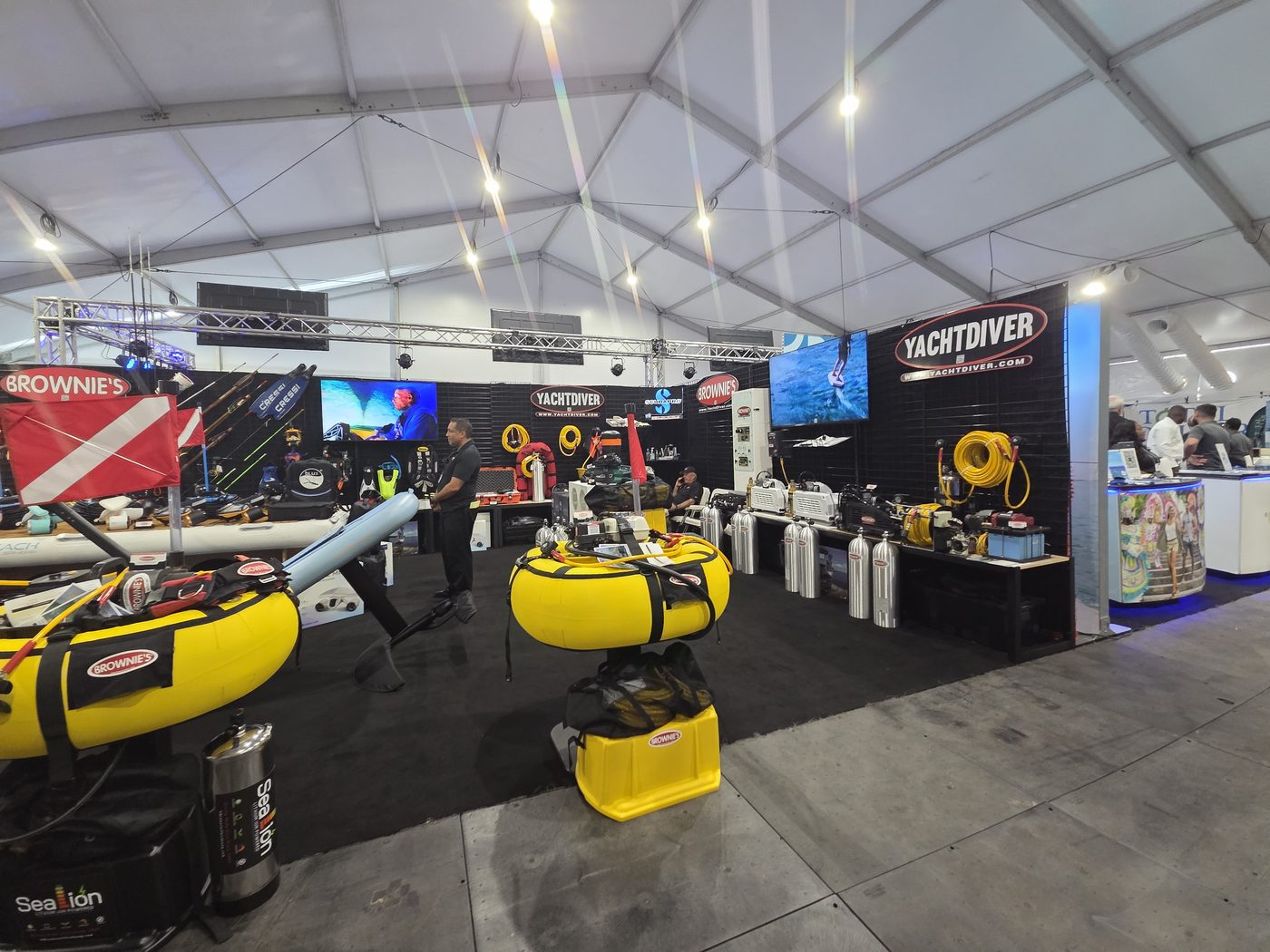YachtDiver and Brownies booth with yellow dive floats at FLIBS 2026
