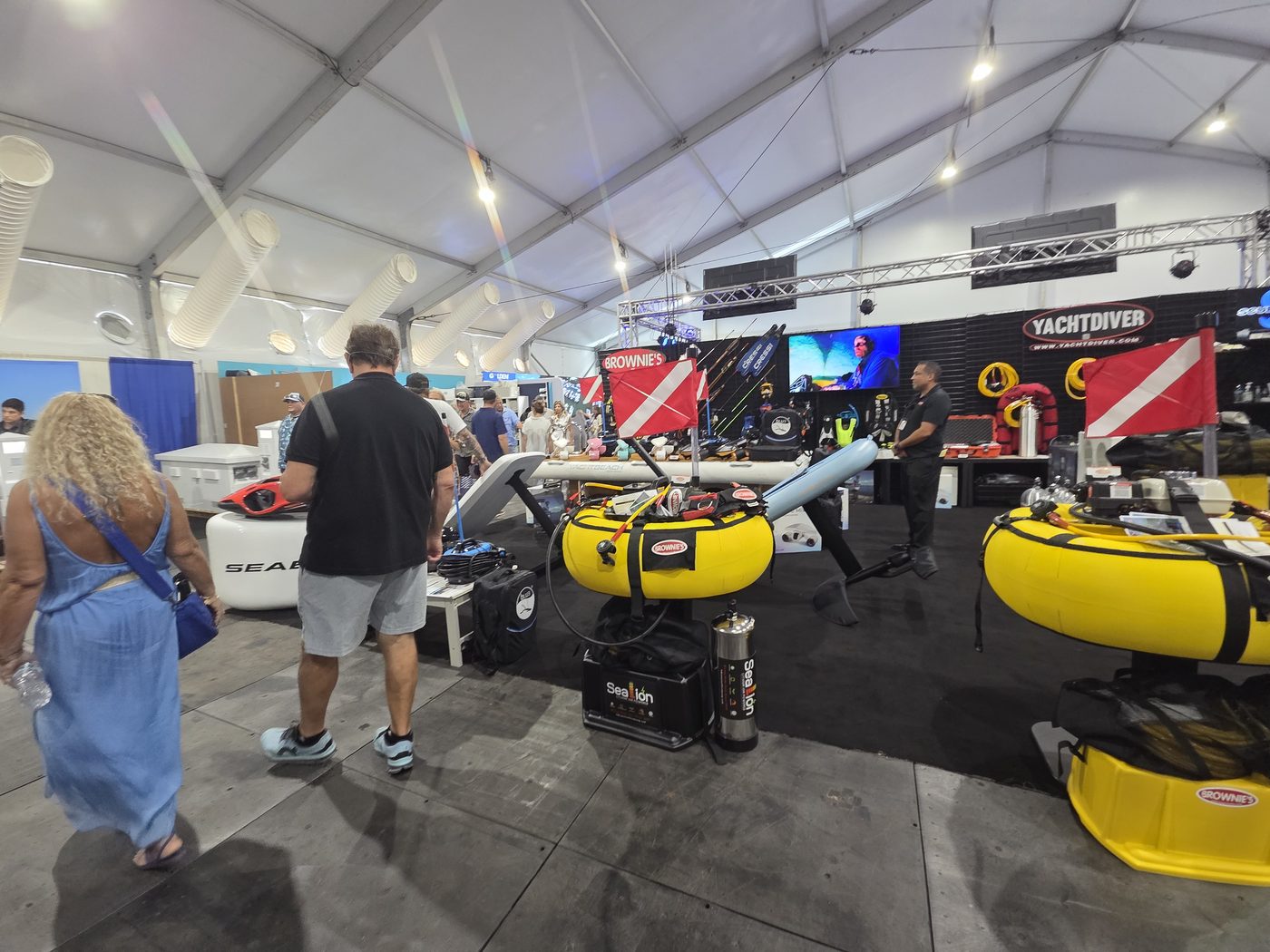 Show visitors at the YachtDiver booth in the exhibit tent