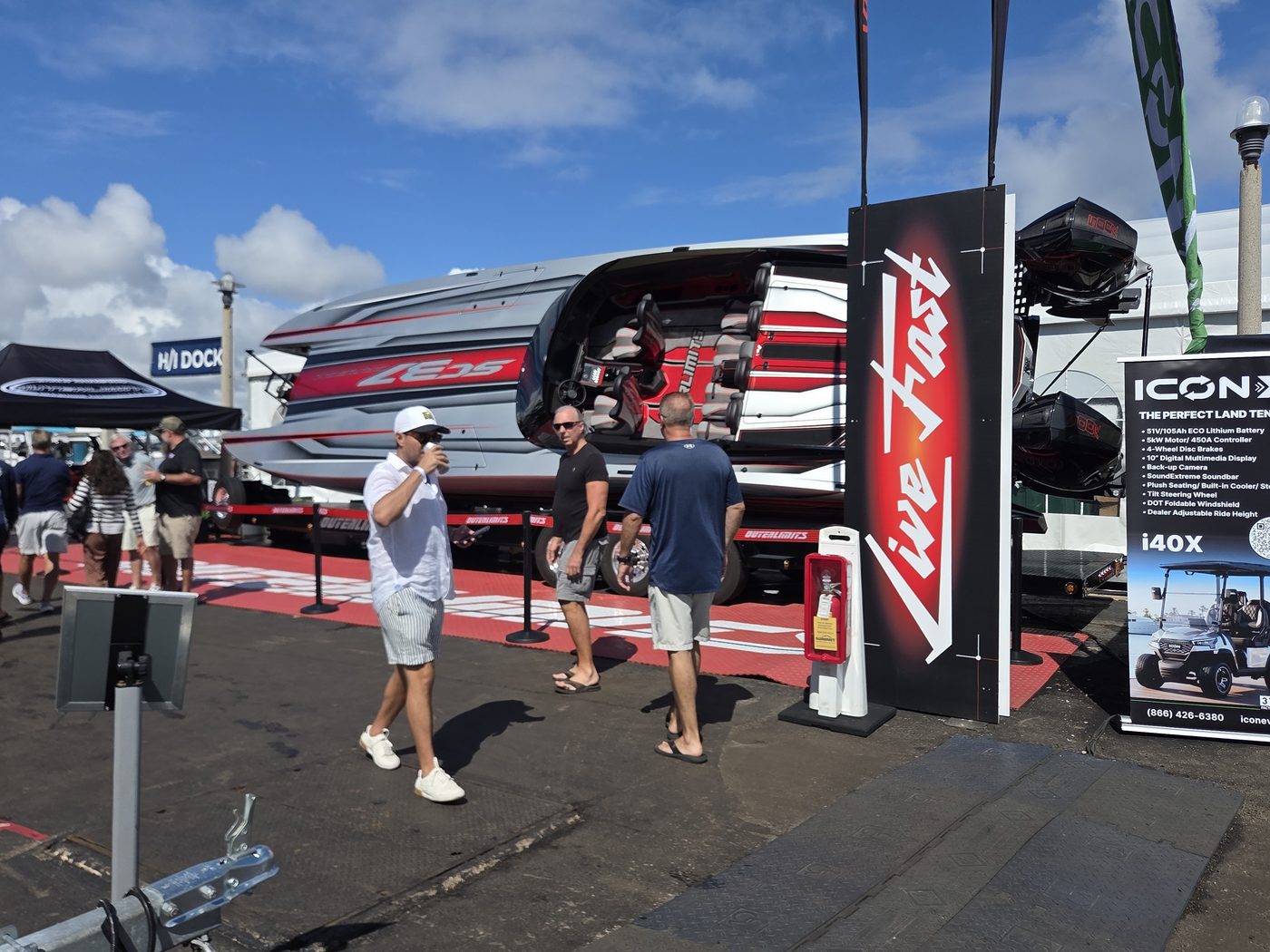 Live Fast display with a performance boat on a trailer