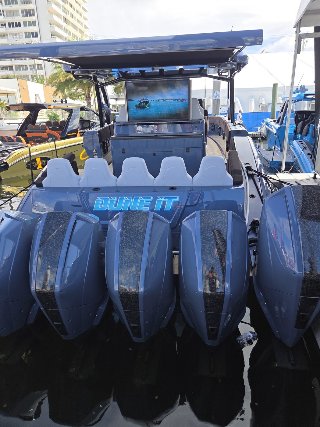 Quad blue outboards on a performance center console at FLIBS