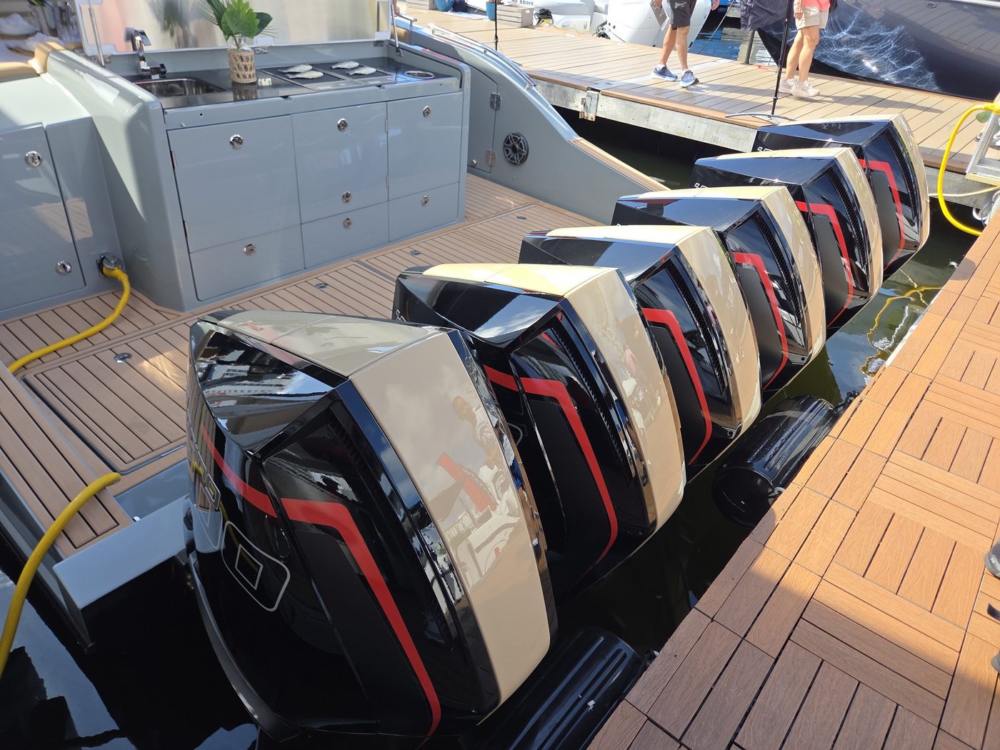 Cigarette transom with six outboards and teak swim platform