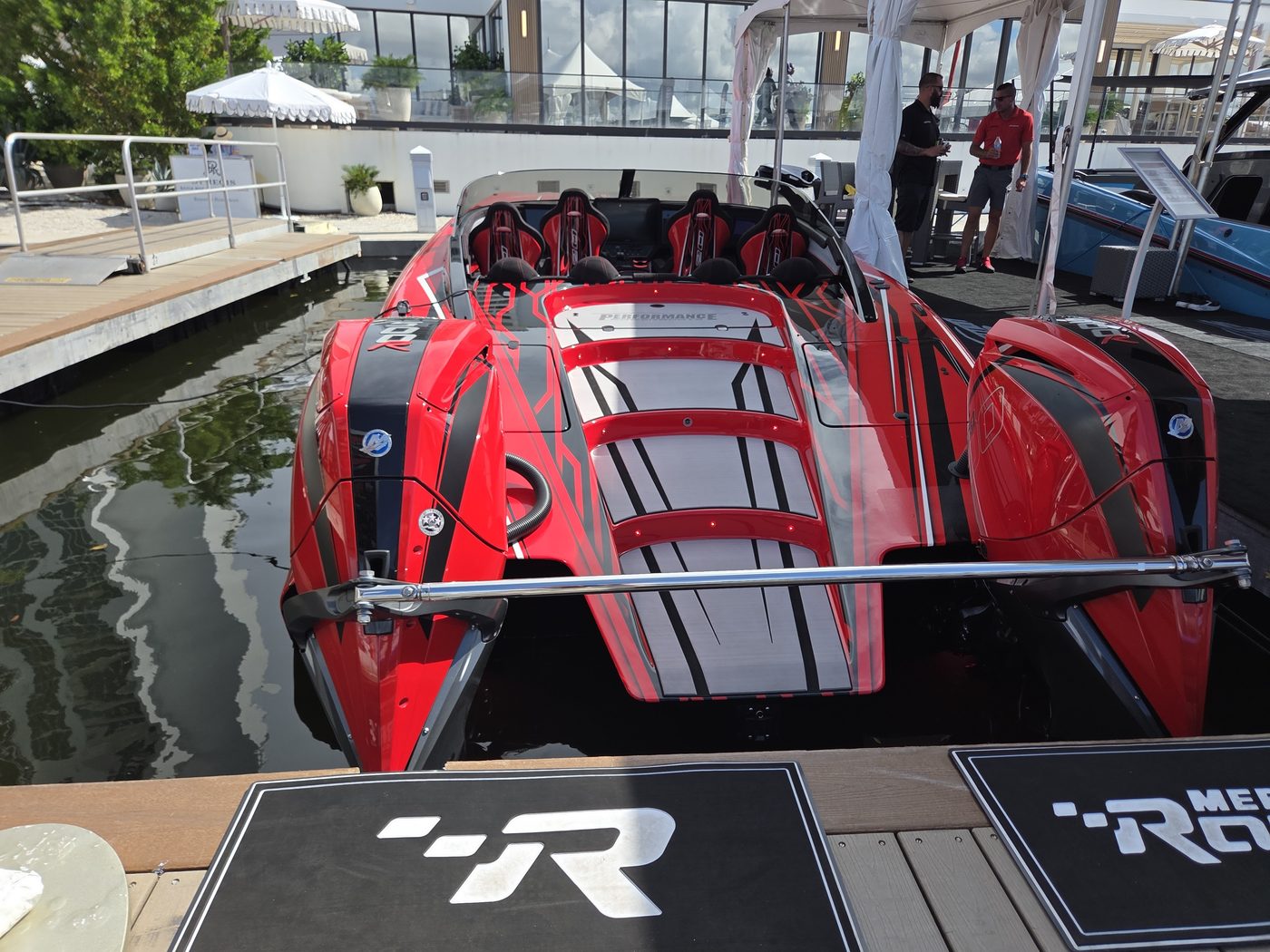 Red and white performance catamaran cockpit with racing seats