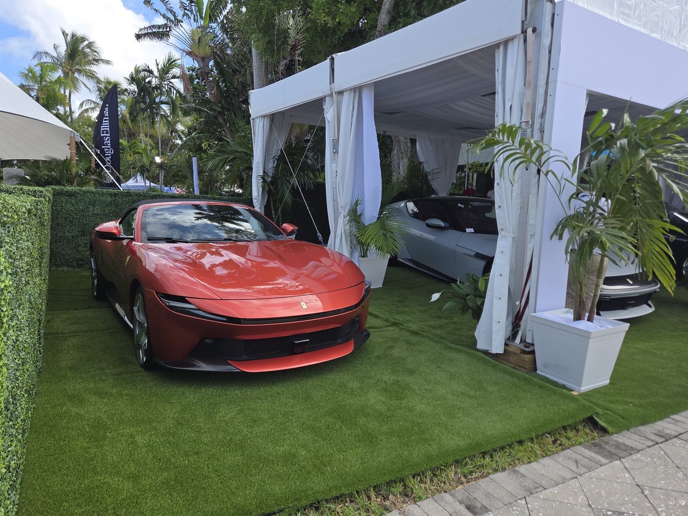 Red Ferrari Roma on artificial turf at FLIBS 2026