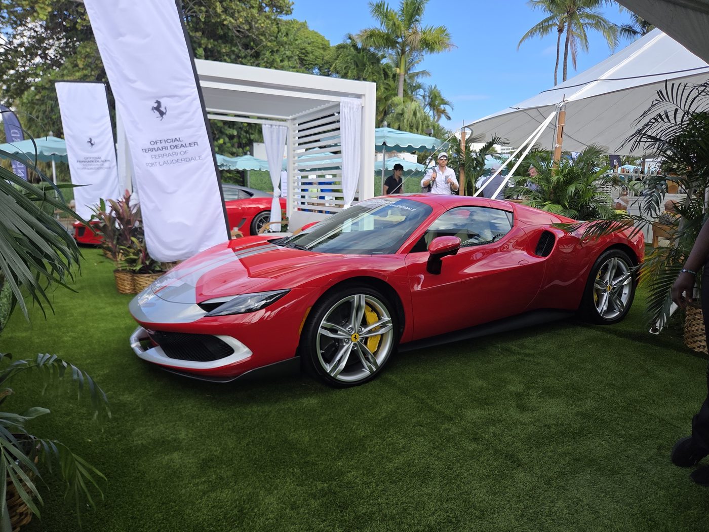 Red Ferrari sports car on display at FLIBS 2026