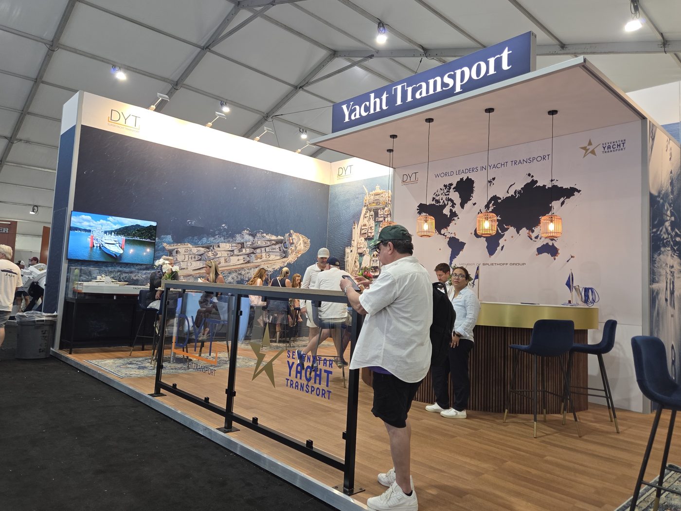 Yacht Transport booth with world map in the exhibit tent
