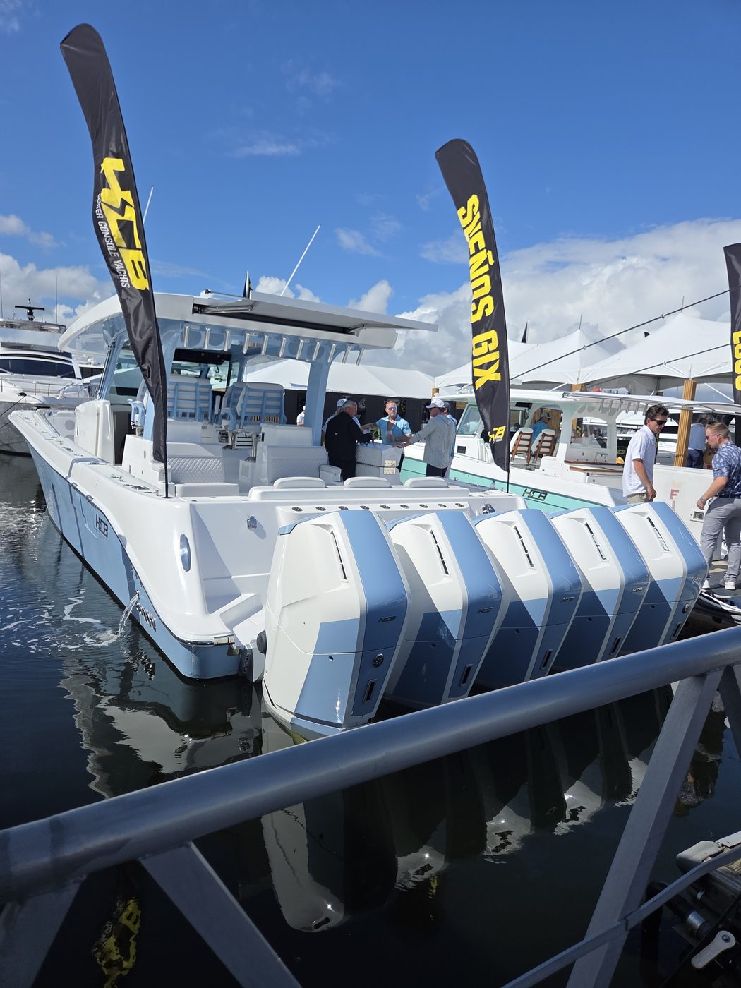 White center console with four white outboards at FLIBS 2026