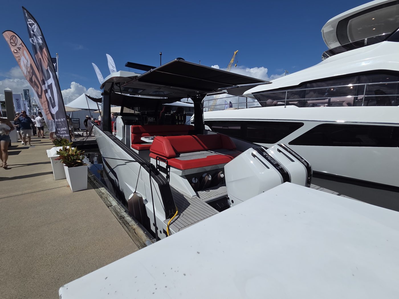 Black dayboat with red interior at the dock at FLIBS 2026