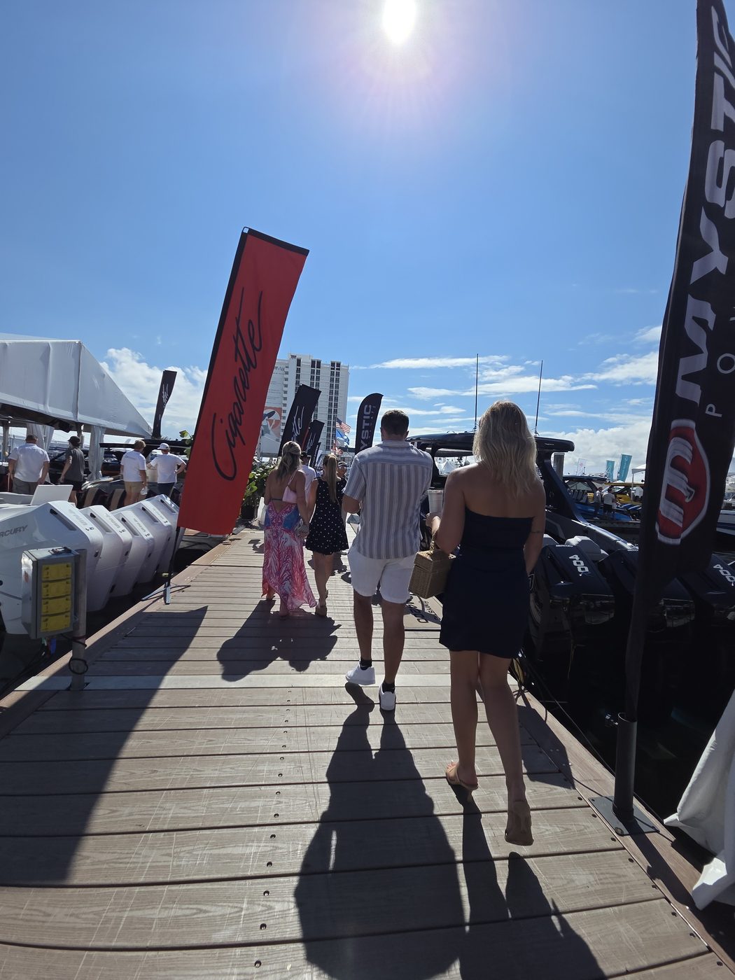 Show visitors walking a sunny dock at FLIBS 2026