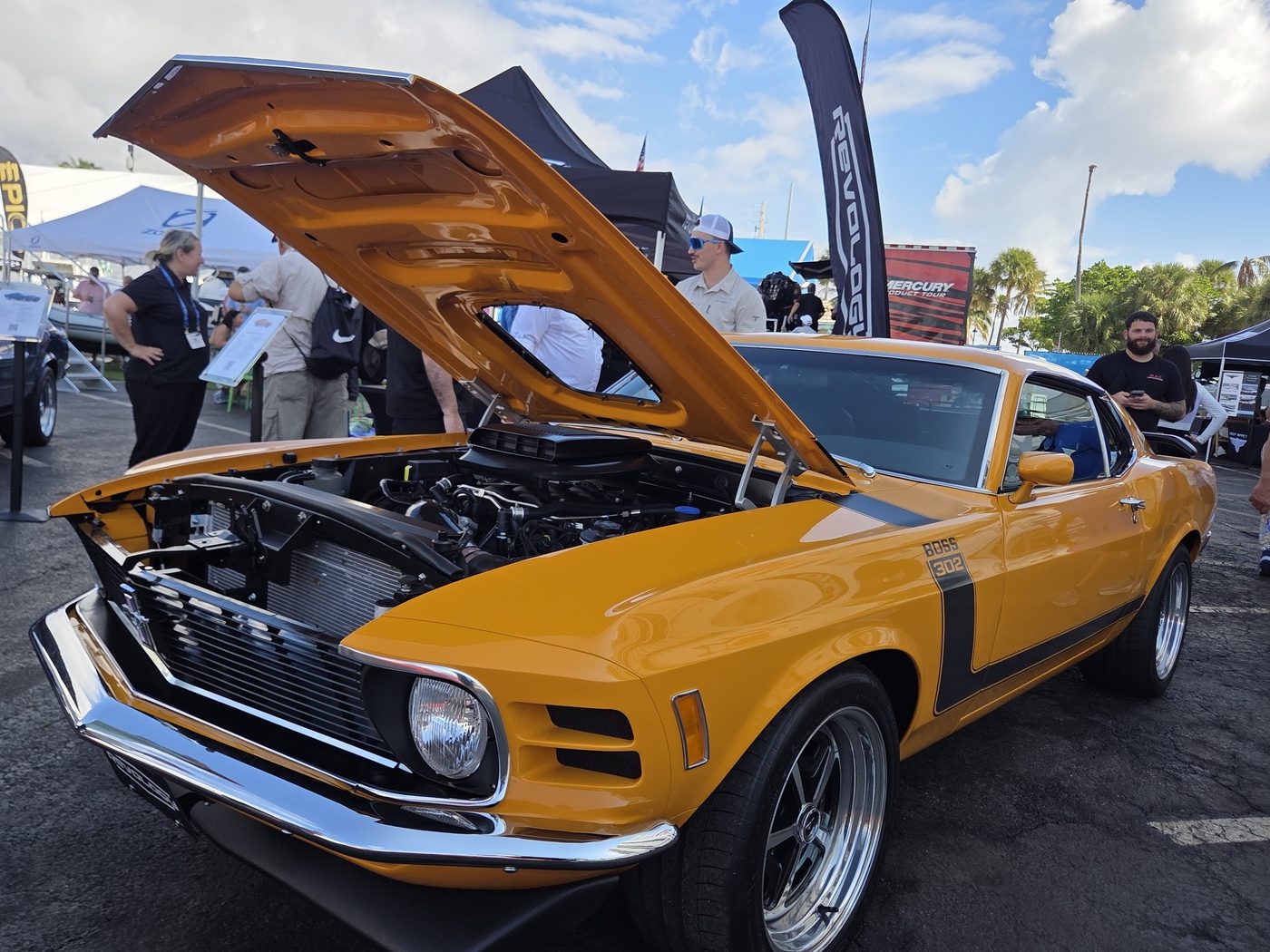 Orange classic Mustang with the hood up at FLIBS 2026