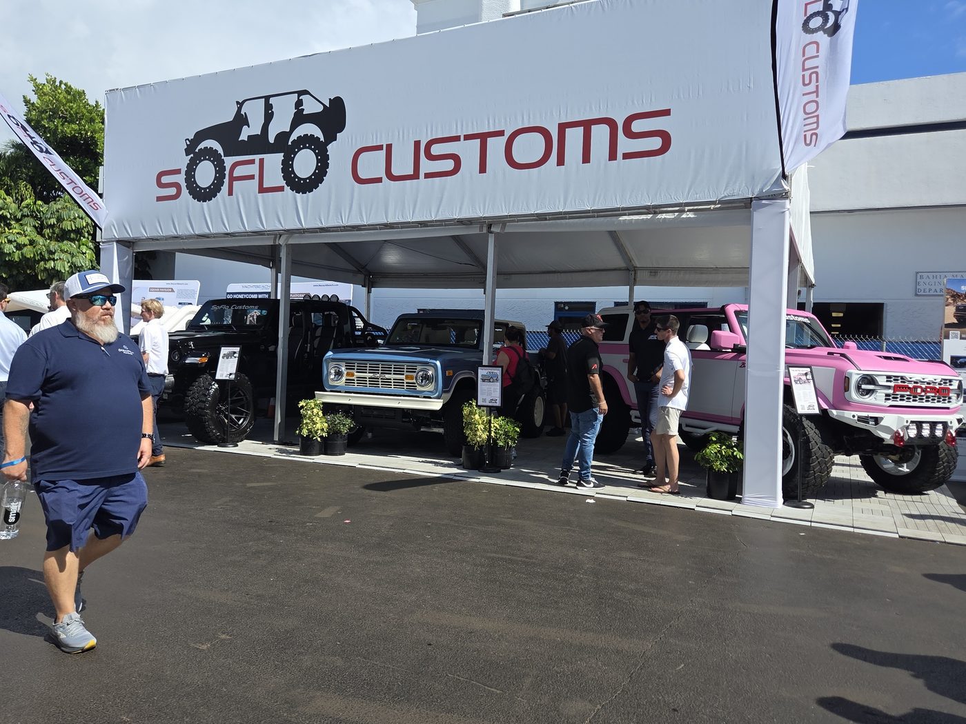 SoFlo Customs tent with custom trucks at FLIBS 2026