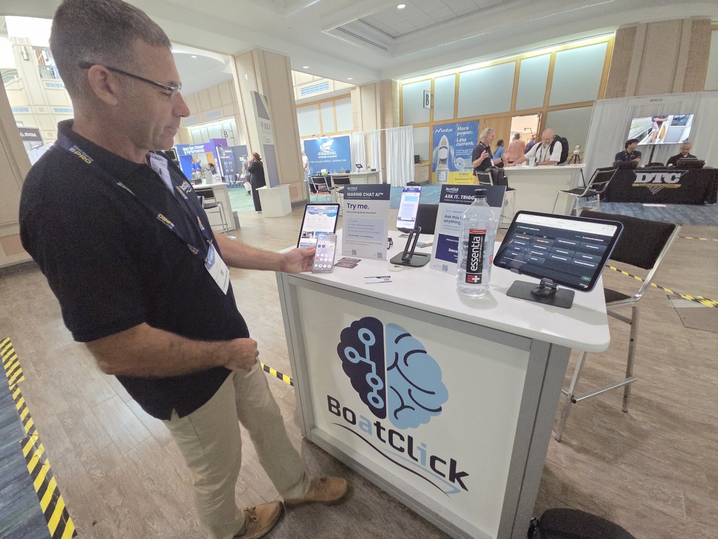 BoatClick booth at IBEX 2026 in Tampa with the BoatClick brain logo kiosk