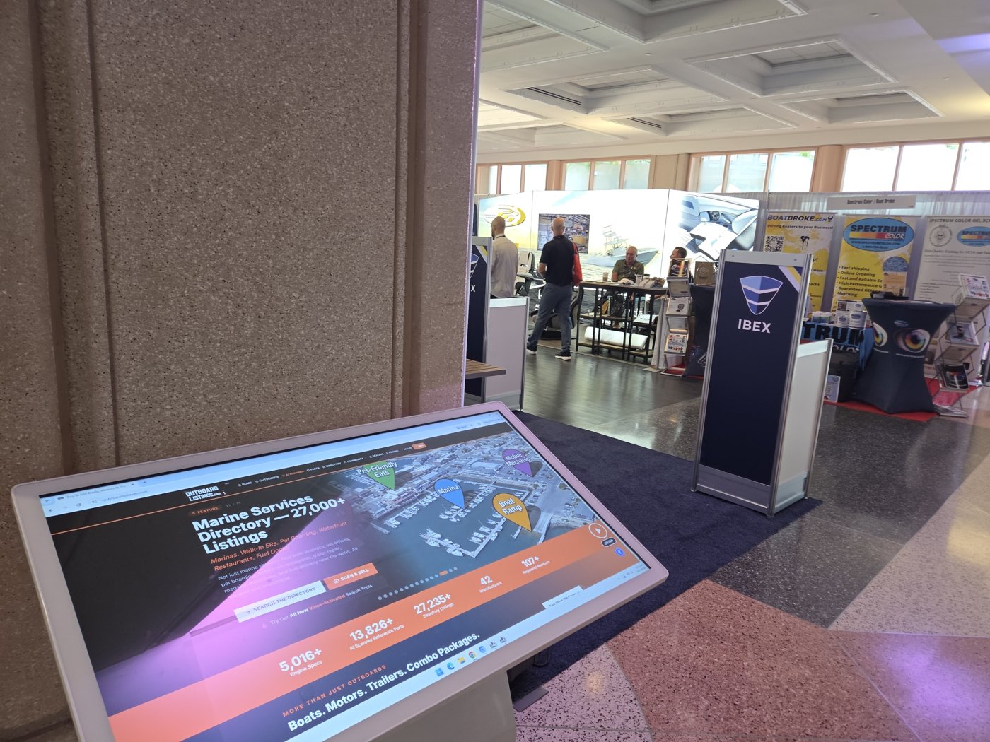 OutboardListings Marine Services Directory on a kiosk screen at IBEX 2026