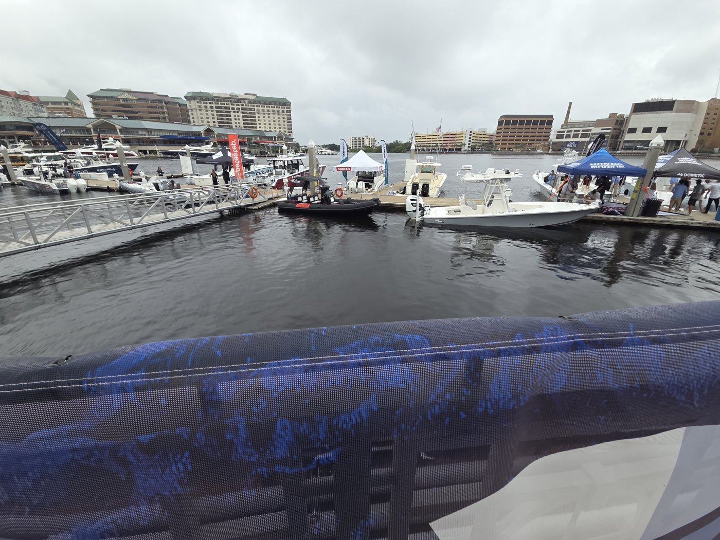 In-water boats at the IBEX Docks with Simrad, Honda Marine and Dometic tents