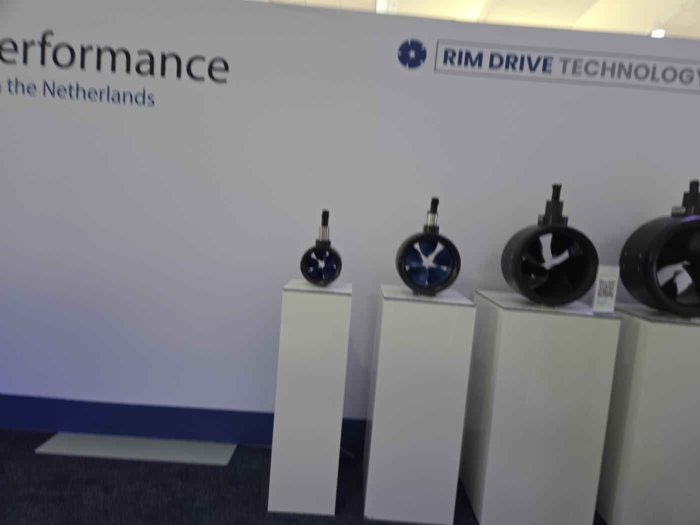 Rim Drive Technology booth with four electric rim-drive thrusters on pedestals