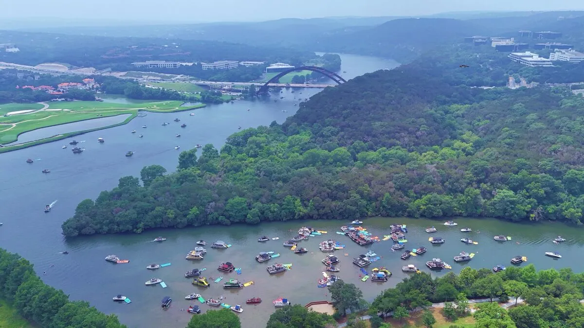 Boats gathered near Starnes Island on Lake Travis Texas