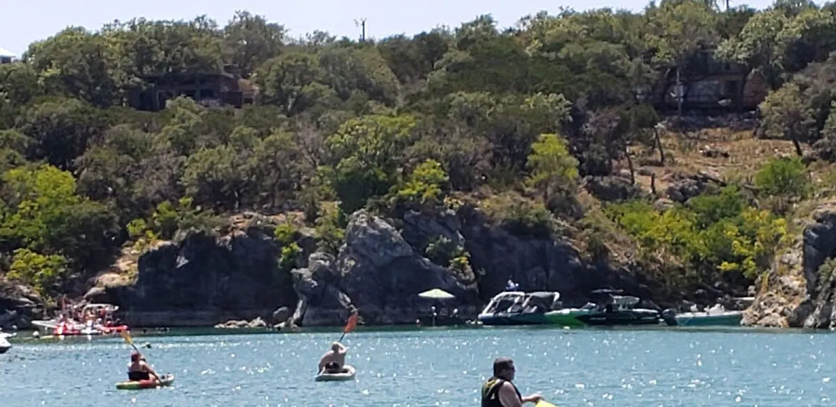 Turquoise water and boats at Party Cove on Canyon Lake Texas