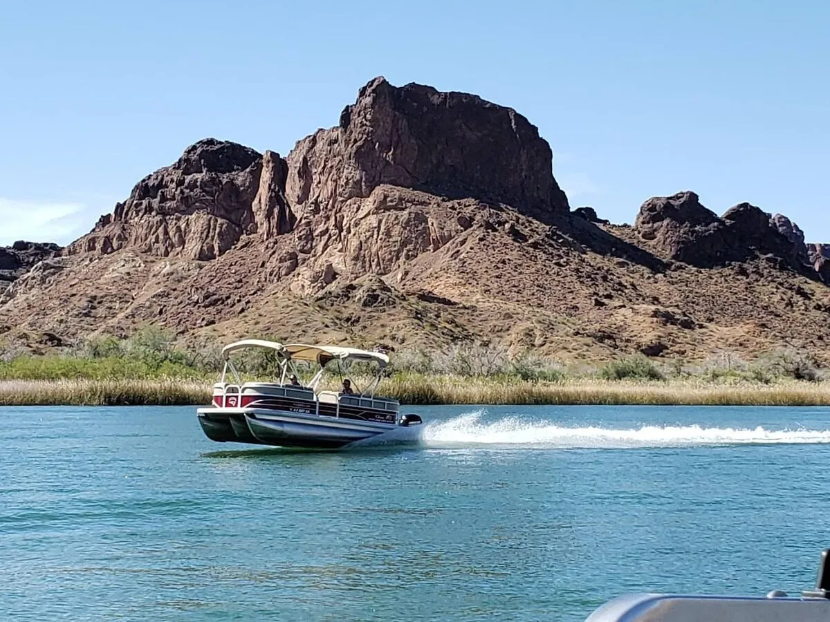 Topock Gorge on the Colorado River with dramatic rock walls and boats