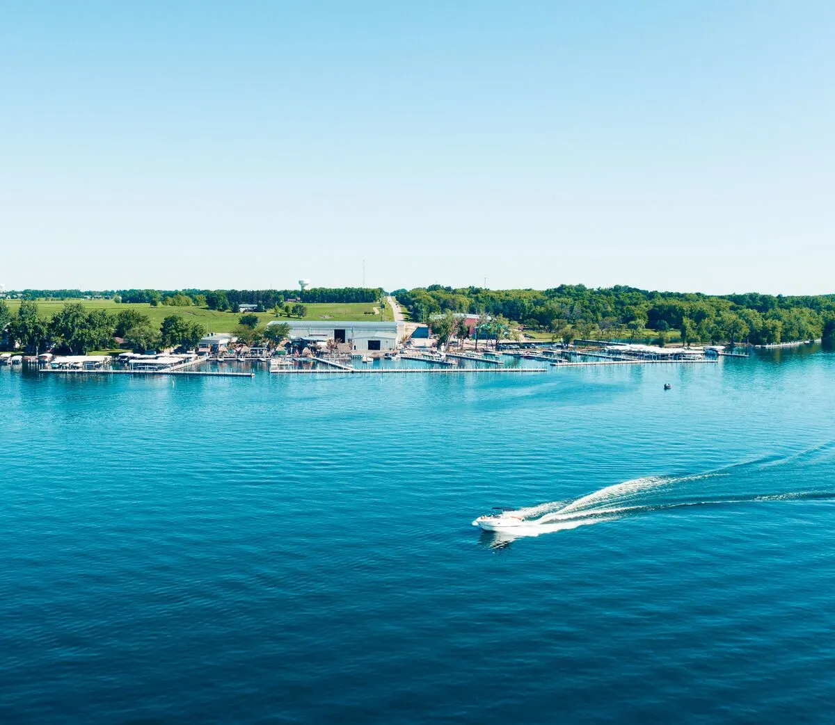 Boats on West Okoboji Lake Iowa with blue glacial water