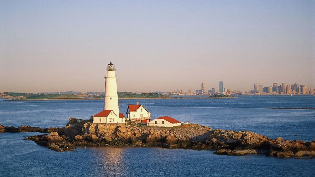 Boston Harbor Islands with boats and the Boston city skyline in the background