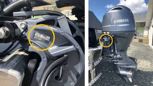 Close-up of outboard engine model and serial number plate